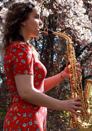 woman playing saxaphone
